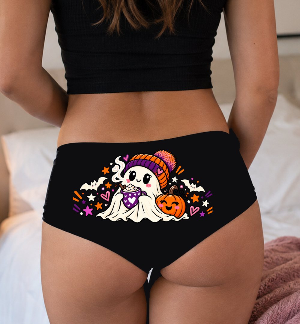 Model in a top wearing black boyshorts with the hot cocoa ghost print