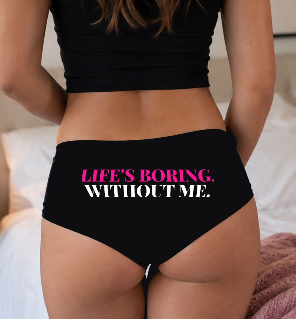 Lifestyle image — Life’s Boring Without Me black cotton boyshort panties with hot pink and white seat print, Sexy Girl Rock