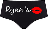 Black underwear with 'Ryan's' text and red lips design on a white background