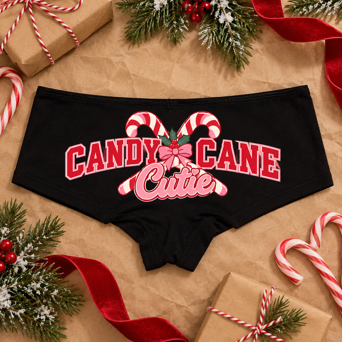 Black low-rise Candy Cane Cutie Christmas boyshort panties with crossed candy canes, pink bow and red varsity letters