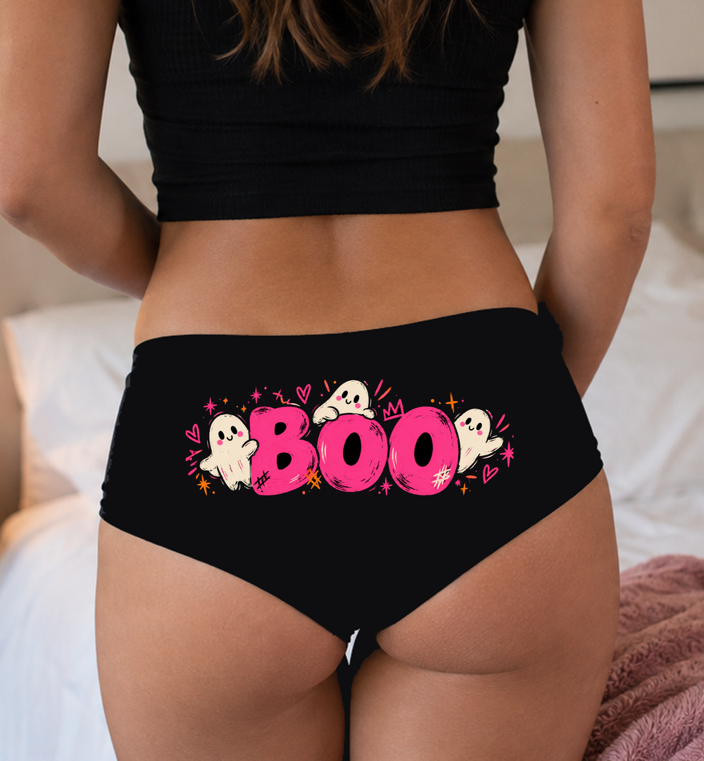 Model in a top wearing black boyshorts with the hot-pink BOO and little ghosts print