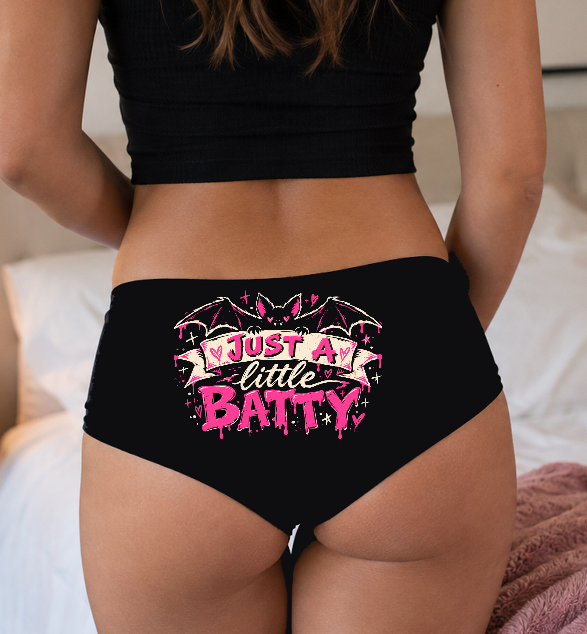 Model in a top wearing black boyshorts with the Just a Little Batty print