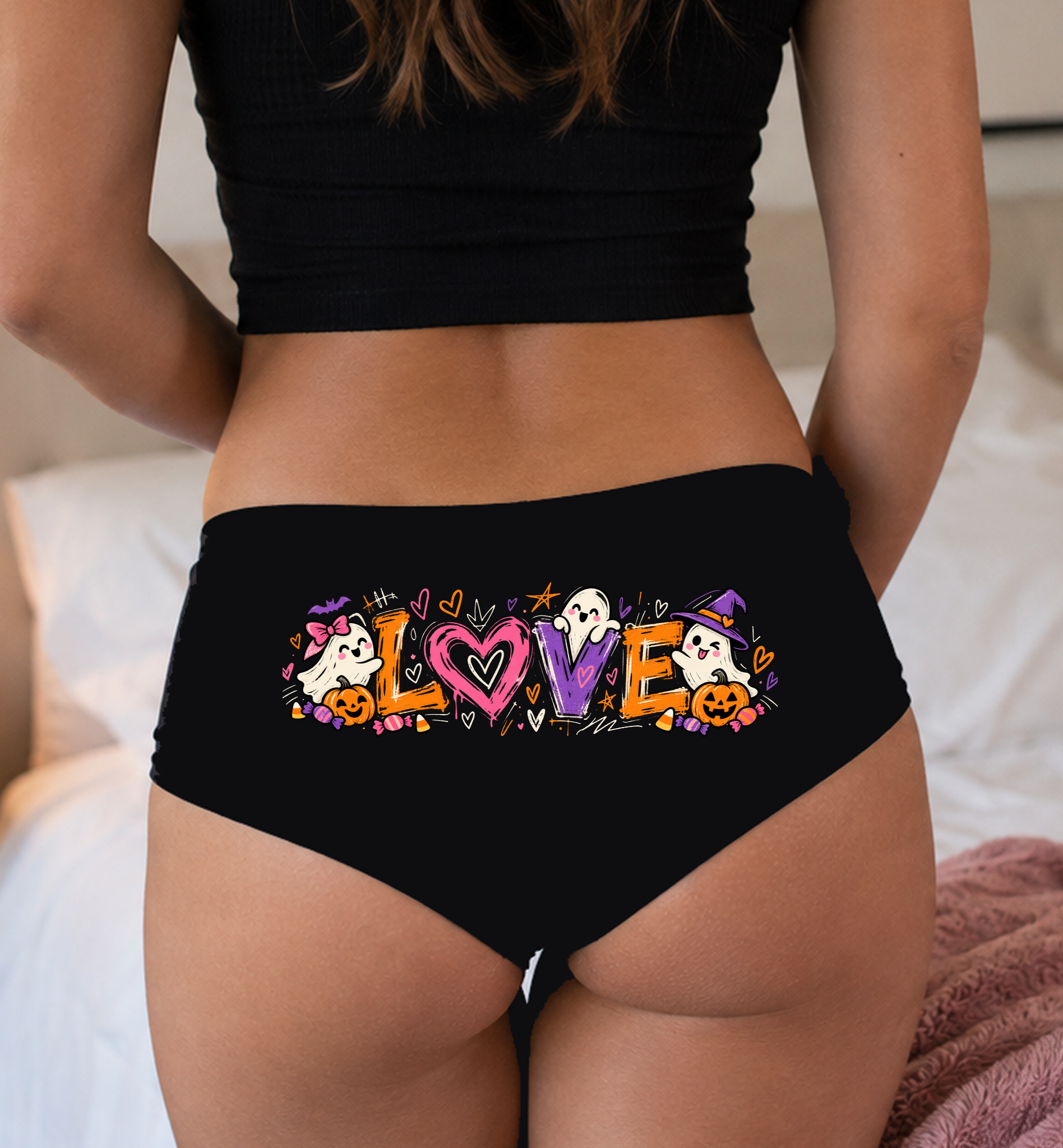 Model in a top wearing black boyshorts with the Halloween LOVE print