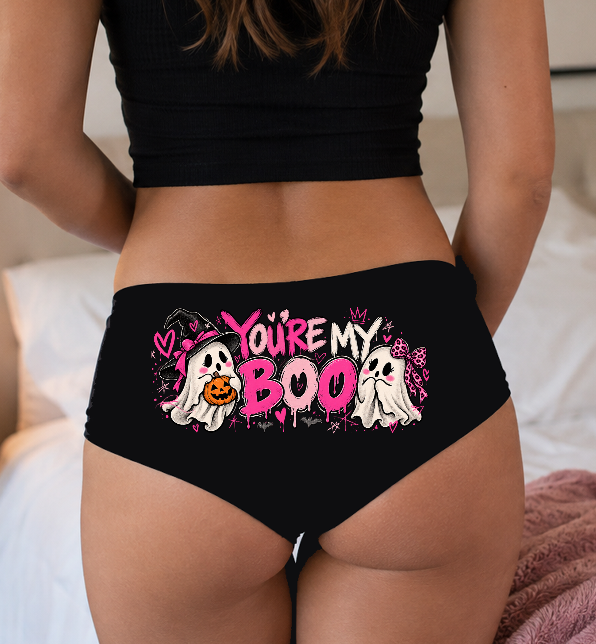 Model in a top wearing black boyshorts with the You're My Boo print