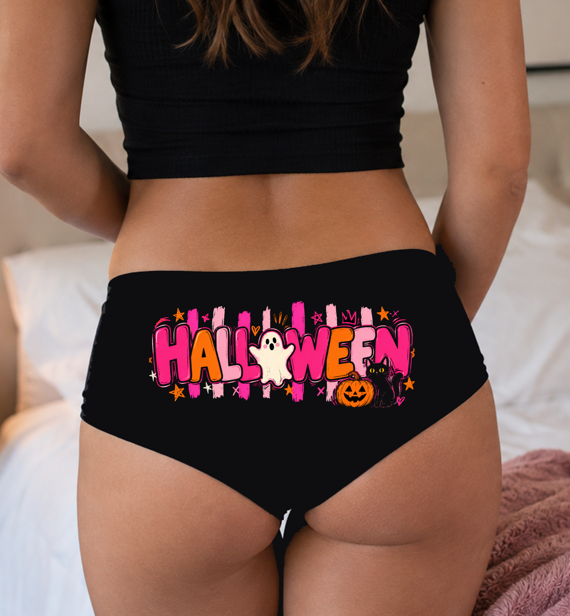 Model in a top wearing black boyshorts with the HALLOWEEN letter print